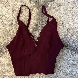 Fitted ribbed maroon cropped tank. Size large but fits like a small.